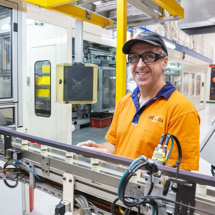 Orora Closures employee smiling at work