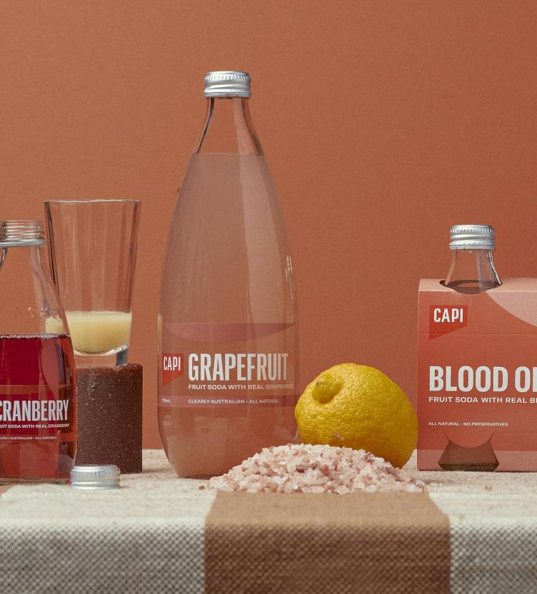 CAPI glass bottles on a table