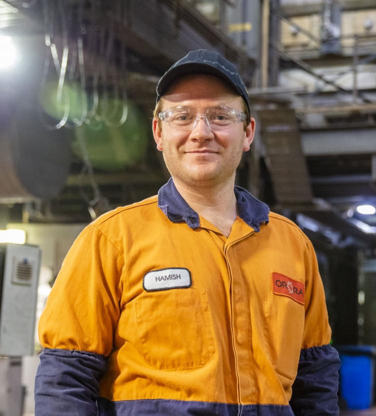 Orora employee in glass plant